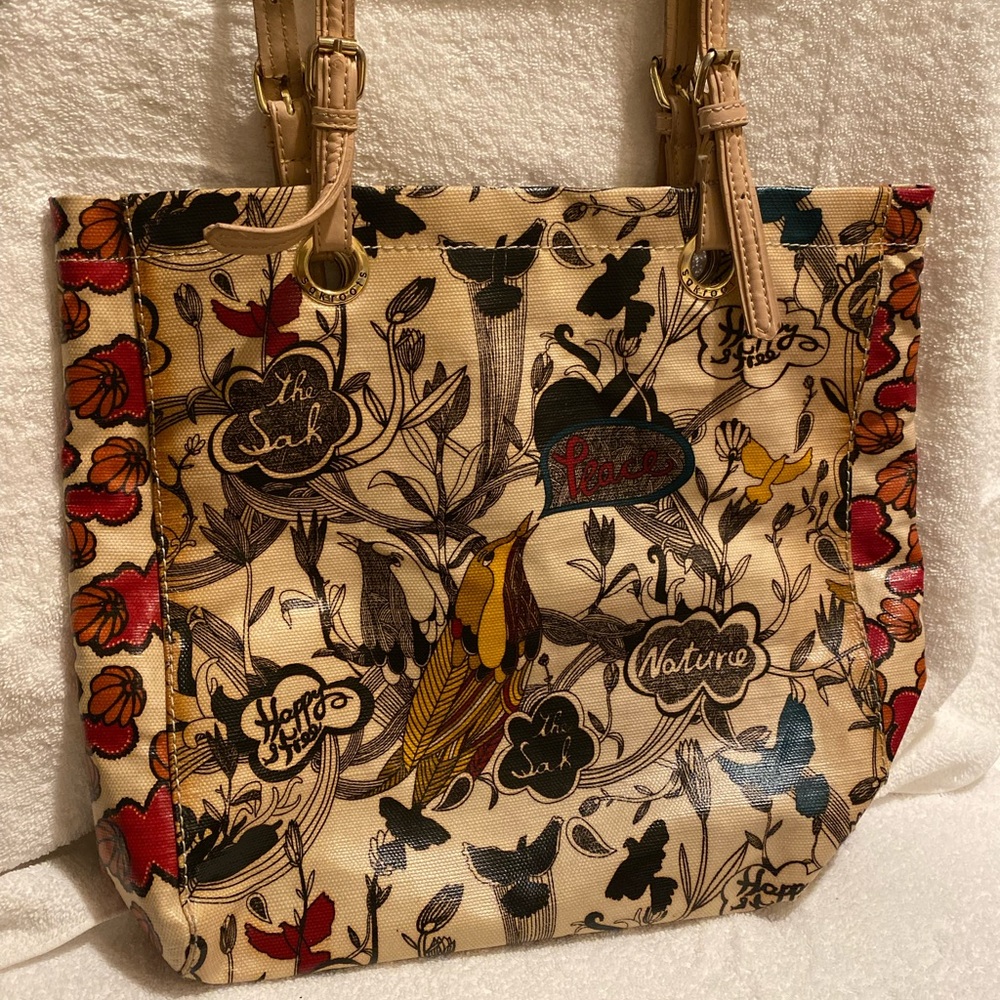 Sak Root Beautiful uniquely printed bag has some wear on straps water resistant.